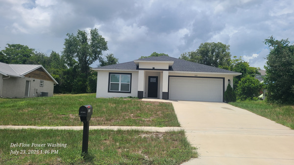 House Washing And Sidewalk Pressure Washing Services Project in DeLand FL 32724