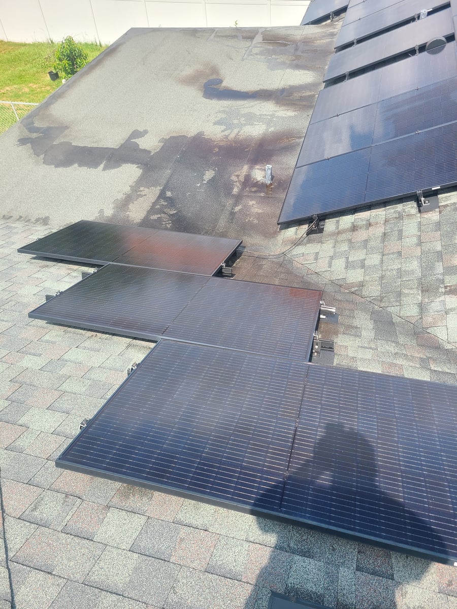 Solar panel cleaning with purified water on residential rooftop