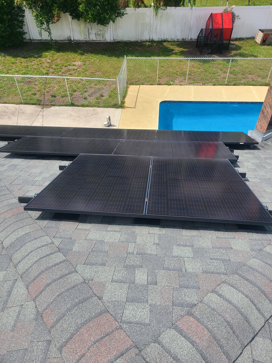 Solar panel cleaning with purified water on residential rooftop