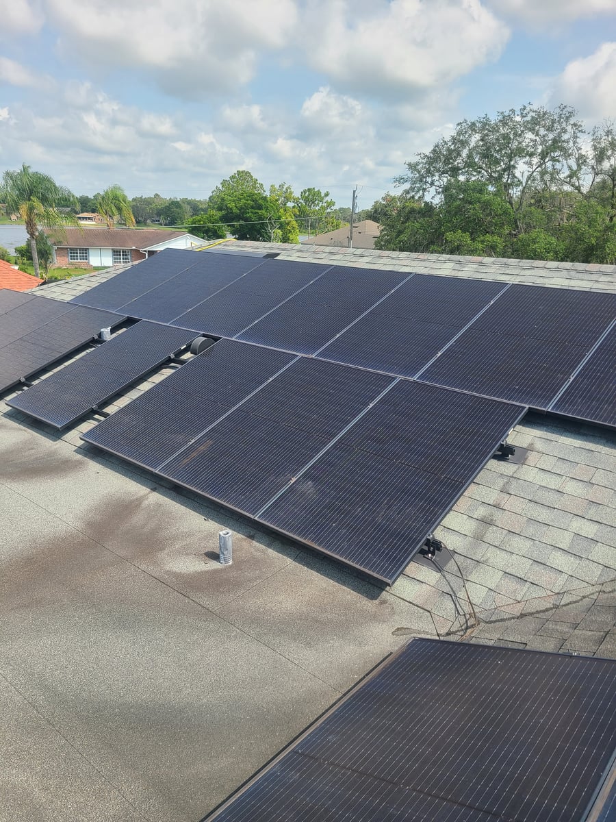 Solar panel cleaning with purified water on residential rooftop