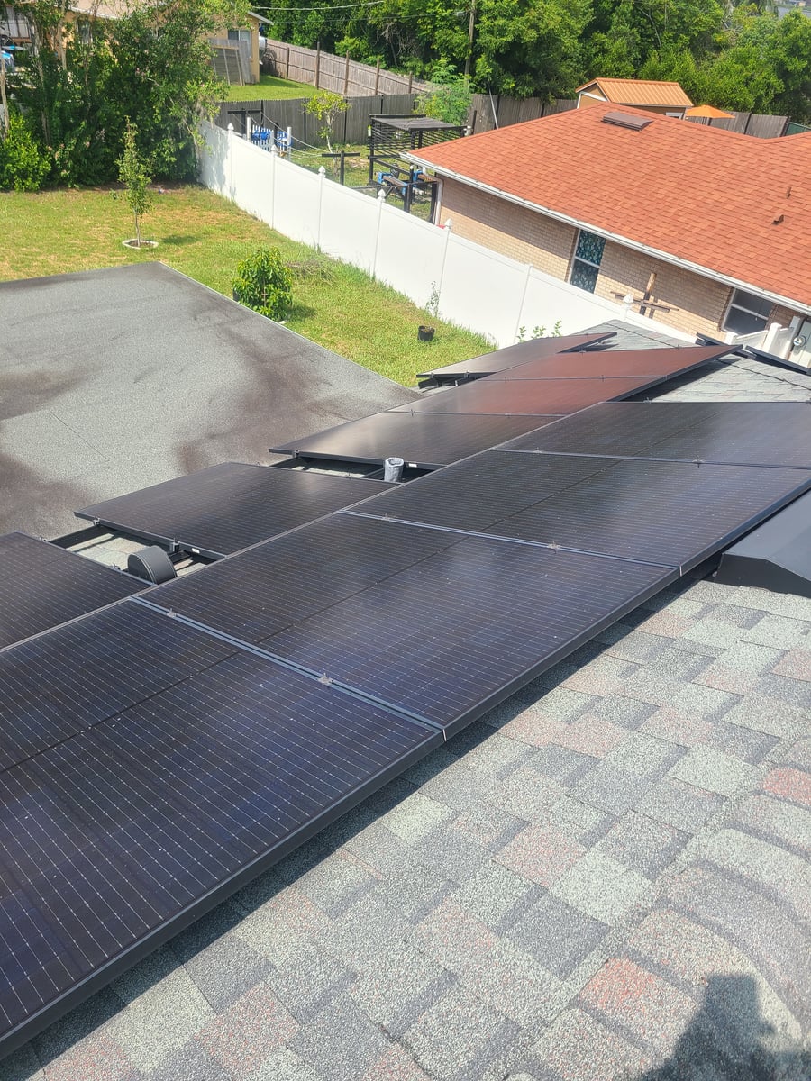 Solar panel cleaning with purified water on residential rooftop